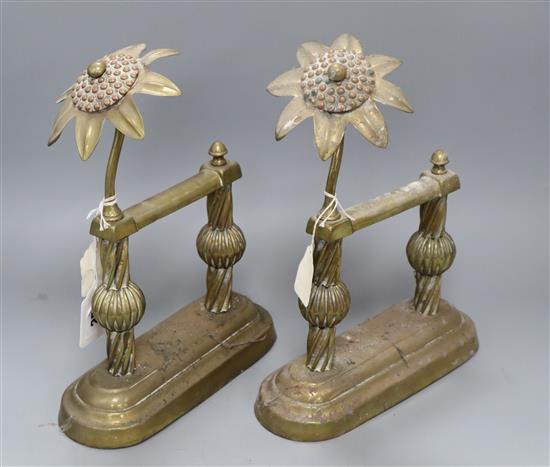 A pair of Arts & Crafts brass and copper passion flower andirons height 30cm